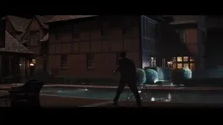Man in suit jumping into pool at night — The Wolf Of Wall Street