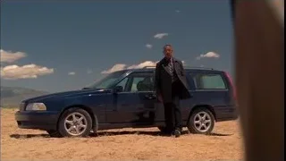 man in suit next to SUV in desert — Breaking Bad