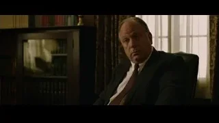 man in suit sitting in chair, deep in thought — The Social Network