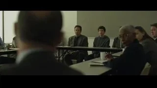 man in suit speaking in conference room — The Social Network