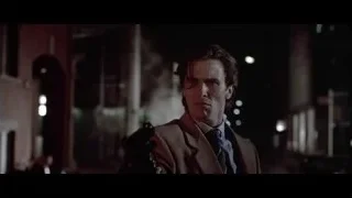 man in suit walking on street at night — American Psycho