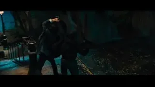 man in suit walking street at night — John Wick: Chapter 4
