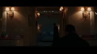 man in suit walking through dim room — Creed 3