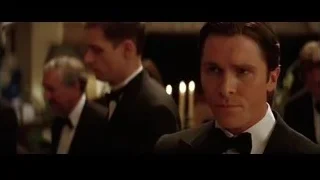 man in tuxedo holding champagne at formal event — Batman