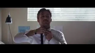Man in white shirt adjusting tie at desk — La La Land