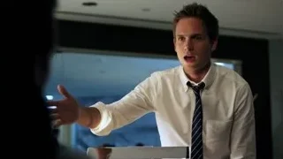 man in white shirt explaining — Suits