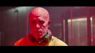 Man in yellow jumpsuit in neon-lit room — Deadpool 2