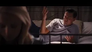 man looking at woman on bed in bedroom — The Wolf Of Wall Street