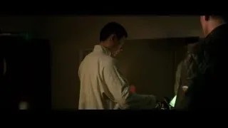 Man looking in mirror in dimly lit room — Bruce Lee: Birth of The Dragon