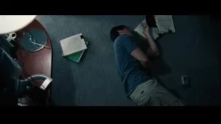 Man lying on office floor — The Big Short
