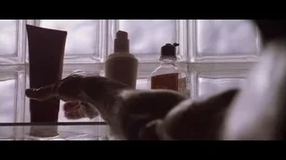 man showering in tiled bathroom — American Psycho
