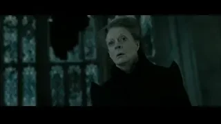 Man sitting in post-apocalyptic desert with soldiers — Harry Potter and the Deathly Hallows 2