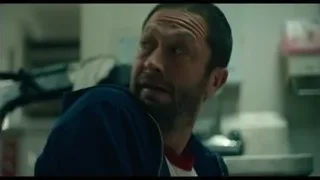 man sitting in room with lockers — The Bear