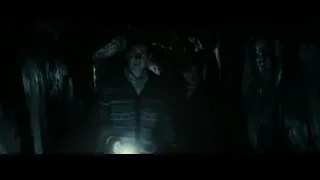 Man standing in dark rocky cave — Harry Potter and the Deathly Hallows 2