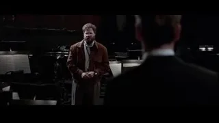 man standing in front of an orchestra — Steve Jobs