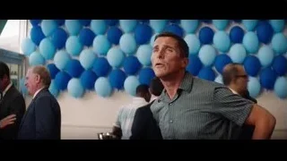 man standing in front of blue balloons — Ford v Ferrari