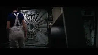 man standing in spaceship doorway — Interstellar