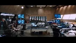 Man standing in workshop with monitors — Iron Man