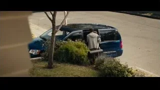 man standing next to blue SUV on street — Furious Seven