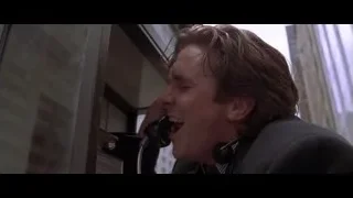 man talking on phone in telephone booth — American Psycho