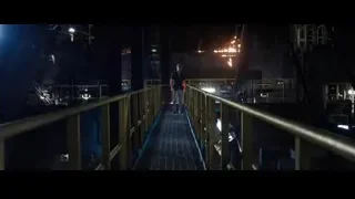 Man walking in dark industrial area — Iron Man 3