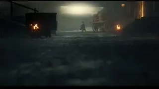 man walking through dark tunnel with burning wagon — Peaky Blinders