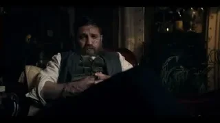 man with beard sitting in dimly lit room — Peaky Blinders