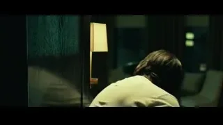 man with blood holding phone to ear — John Wick