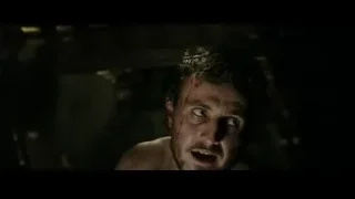 Man with bloody bruised face in dark room — Gladiator 2