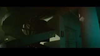 Man working on metal object in dim light — Furious Seven