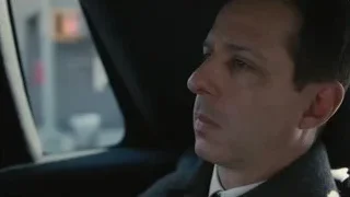 Man's face in car on city street — Succession