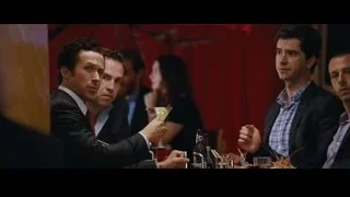 men conversing at a dimly lit restaurant — The Big Short