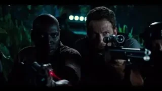 men holding guns in dark forest — Jurassic World