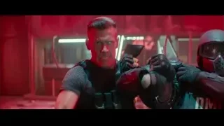 Men with guns in dark neon-lit room — Deadpool 2