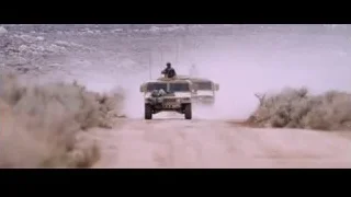 Military vehicles driving through desert dust storm — Iron Man