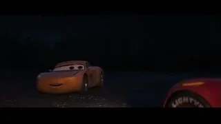 orange Cars 3 car parked at night — Cars 3
