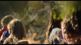 people holding cups in wooded area — The Bear