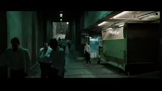 people walking down a dimly lit industrial hallway — Fight Club