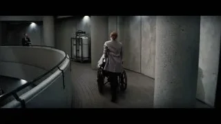 people walking down curved staircase in modern building — Interstellar