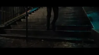 people walking up stairs with torches at night — John Wick: Chapter 4