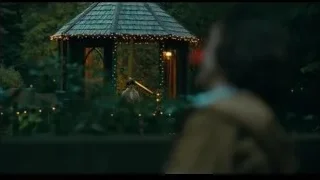 person in red clown mask on balcony — Joker