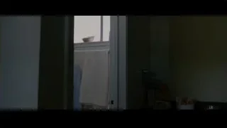 person looking at clothes by door — The Persuit of Happyness