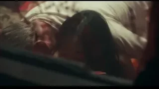 Person lying on bed with red blanket — Peaky Blinders