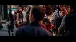 police officer speaking to people in dark room — The Amazing Spider Man 2
