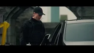 police officer with clipboard by black car — The Amazing Spider Man 2