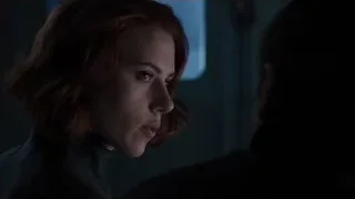 Red-haired woman in black suit — The Avengers