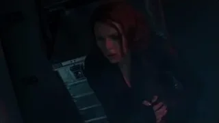Red-haired woman in dark room with red light — The Avengers