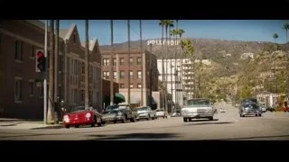 Red vintage car on Hollywood street — Ford v Ferrari