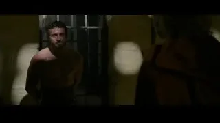 shirtless man and woman in stone room — Gladiator 2