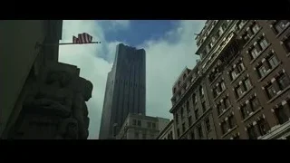 Skyscraper with American flag and statue — The Social Network